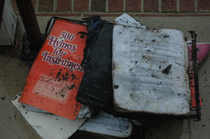 Charred books were placed on steps of Manship Chapel building. (Photo: Delaware Free News)