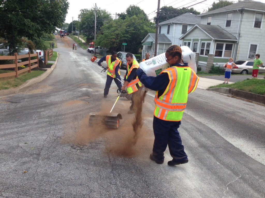 Crews work to clear spilled fluid from South Dupont Road. (Photo: Delaware Free News)