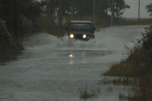 A Jeep plows through floodwaters on Lighthouse Road near Slaughter Beach. The road leads from Route 36 to the DuPont Nature Center at Mispillion Harbor as well as a small number of homes and a state boat launching area. (Photo: Delaware Free News)