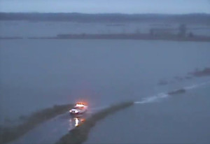 A DelDOT truck travels on flooded Prime Hook Road at sunrise today. (Photo: DelDOT traffic cam)