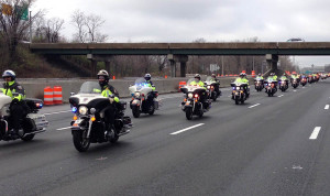 Motorcycle police officers escorted the body of Officer Jacai D. Colson on way to final resting place in Pennsylvania. (Photo: Delaware Free News)