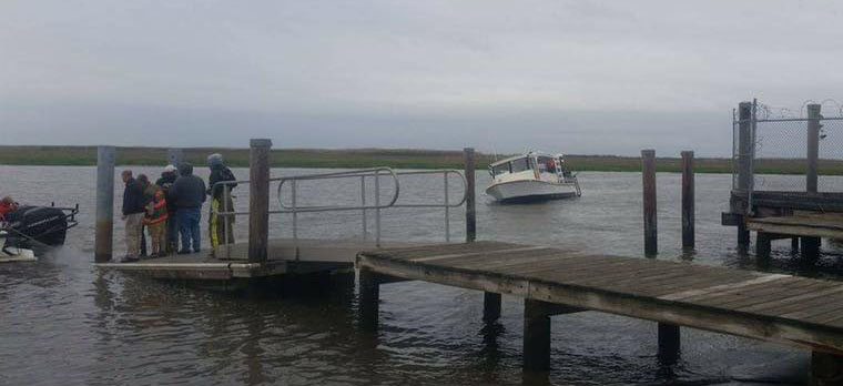 Firefighters were able to right the boat and tow it to dock, where it was pumped out. (Photo: Little Creek Volunteer Fire Company via Facebook)