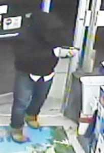 Surveillance image from Uptown Liquors robbery released by Milford police.