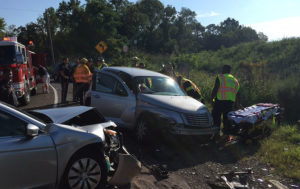 Good Will firefighters work to free trapped driver at crash scene on Route 9. (Photo: Delaware Free News) 