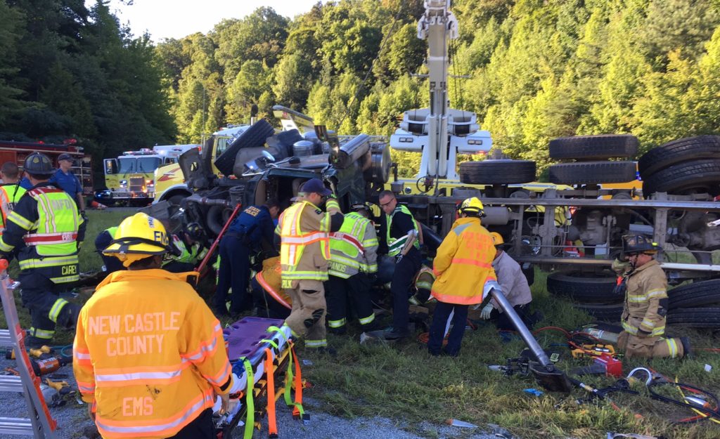 Aetna Hose, Hook & Ladder Company firefighters extricate dump truck driver. (Photo: Delaware Free News)