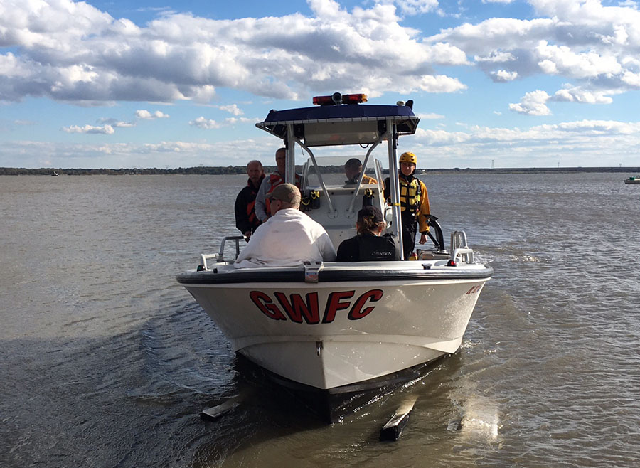 Couple was returned to shore on Good Will Fire Company boat after their sailboat overturned in Delaware River. (Photo: Delaware Free News)