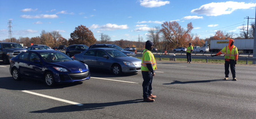 DelDOT front-end loader overturned in ditch on southbound Interstate 95 south of Route 141. (Photo: Delaware Free News)