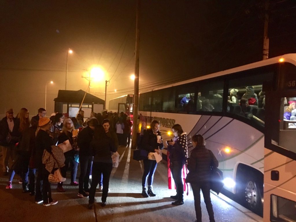 People heading to the Women's March on Washington board buses at park-and-ride lot near Routes 273 and 7. (Photo: Delaware Free News)