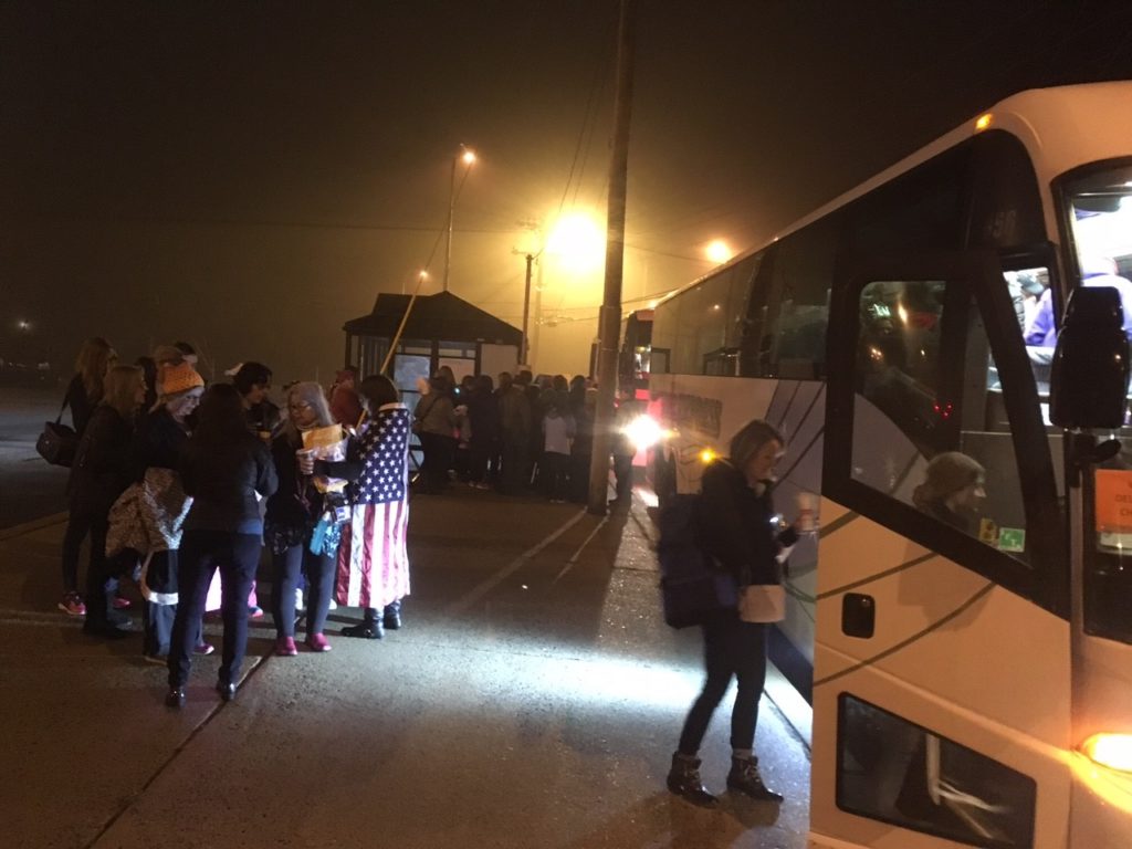 People heading to the Women's March on Washington board buses at park-and-ride lot near Routes 273 and 7. (Photo: Delaware Free News)