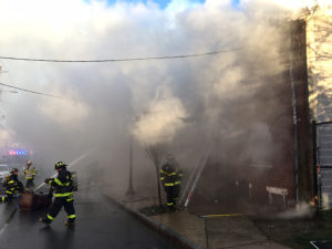 Fire began in vacant home at 44 E. 22nd St. in Wilmington and spread to adjacent dwellings. (Photo: Delaware Free News)