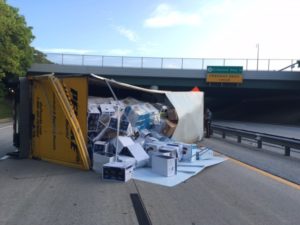 Box truck carrying electronic equipment overturned on southbound Route 141 at Boxwood Road. (Photo: Delaware Free News)
