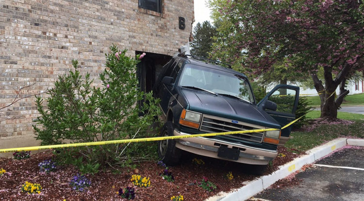 No one was injured but the building was heavily damaged about 12:30 p.m. today when an elderly woman backed an SUV into The Creeks at Marshallton Apartments. New Castle County police were on the scene and awaiting a building inspector before removing the vehicle. (Photo: Delaware Free News)